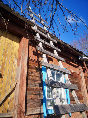 The staircase on the side of an old a village houseの写真素材
