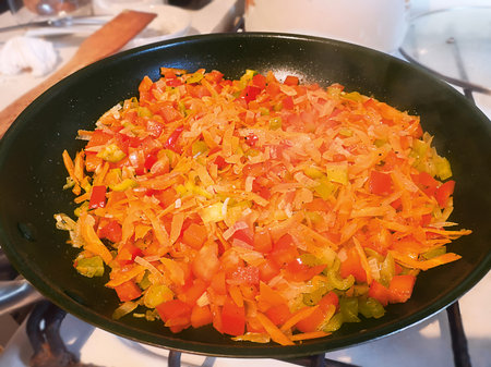 The vegetables are stewing in a skilletの写真素材
