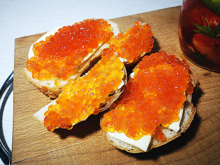 Appetizing red caviar sandwiches. Festive breakfast. Delicious breakfastの写真素材