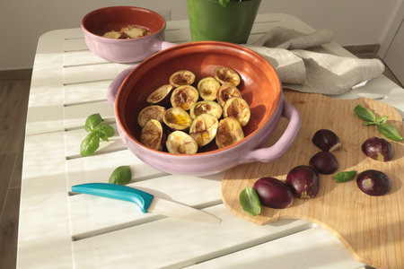 Mini eggplants in bowl. Vegetables and healthy eating. Ecologically clean products from the garden.