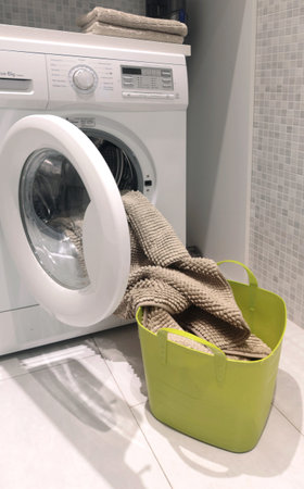 Laundry room in house. Washing machine and linen storage cabinet. Cleanliness and lifestyle. Activities, house cleaning. High quality photoの写真素材