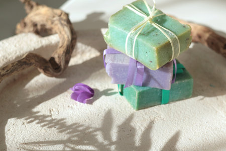 Cubes of natural soap against backdrop of natural elements. Handicrafts and hobbies. Cosmetics and...