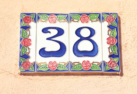 Ceramic plaque with house number 38. Traditional Italian craft. Design and floral pattern. High quality photoの写真素材