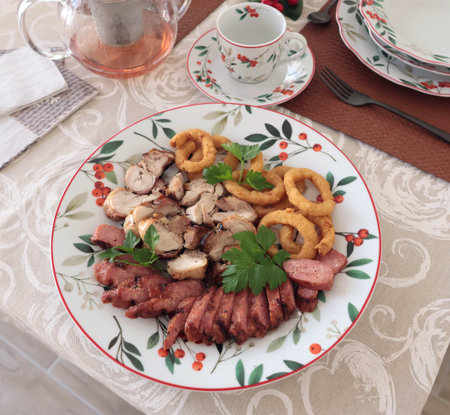 Table setting with bright tableware, berries, and twigs. Aesthetics and lifestyle. Interior design. Meat platter, appetizer. . High quality photoの写真素材