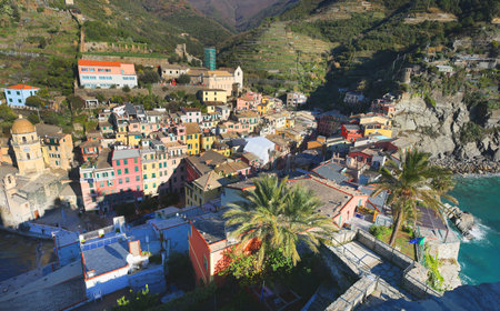 View of Vernazza, town in Cinque Terre, from mountain. Nature and sea, traditional buildings of...