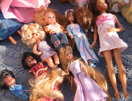 Antique flea market in Europe, Italy. Vintage items. Set of dolls on table, toys, background for design. High quality photoの写真素材