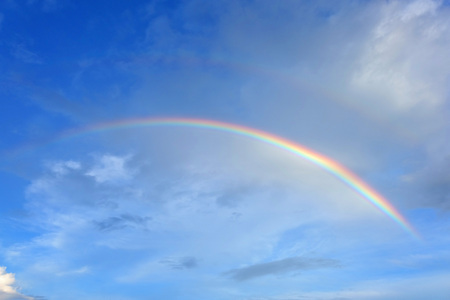 Rainbow on the blue skyの写真素材