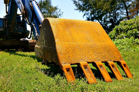 Digging buckets at construction siteの写真素材