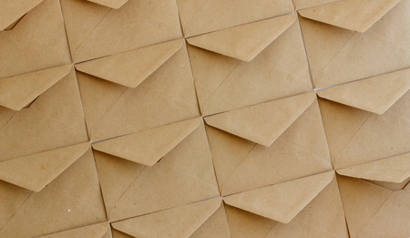 The layout of the envelope template is made of brown kraft paper. Flat lay.の写真素材