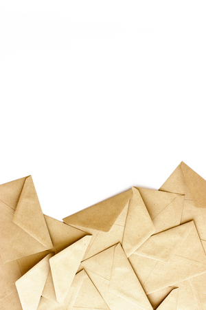 Kraft envelopes on a white background with space for text or design. Flat lay.の写真素材