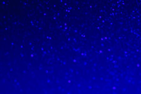 Shiny blue defocused background. Bright shiny background. Abstract background. Shine. Selective focus.の写真素材