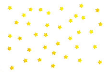 Festive gold stars isolated on white background.の写真素材