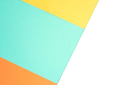 Abstract background of four trending colors Orange Tiger, Mimosa, white, Biscay green. Mint, white, yellow and orange. Geometric background.の写真素材