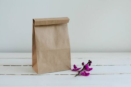 Ecological packaging of goods and food. A sprig of lilac orchid.の写真素材
