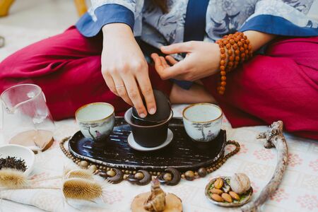 Preparing for the tea ceremony. Tea ceremony. Tea master pours Chinese tea.の写真素材