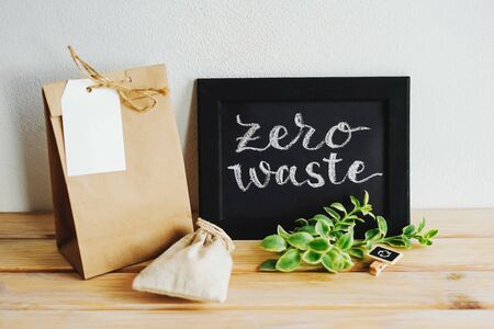 Wooden shelf with a label zero waste. On the shelves are items made of environmentally friendly materials.の写真素材