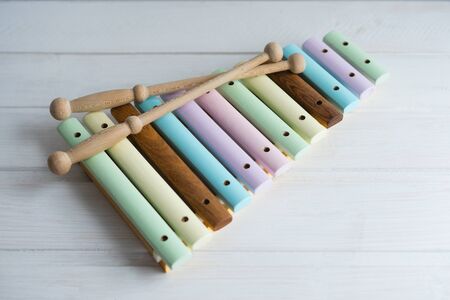 Xylophone made of natural wood. A musical instrument. Children's toy made of natural wood. Colorful xylophone keys.の写真素材
