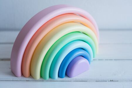 A wooden toy for a child. The rainbow is made of natural wood.の写真素材
