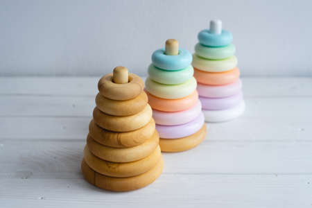 Three different pyramids made of natural wood for children. Beautiful toys that are safe for children's health. Colorful wooden pyramids.の写真素材