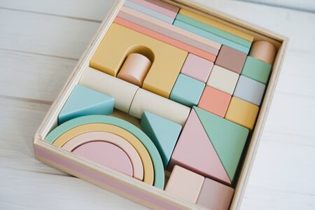 Childrens wooden constructor. Toys made of natural materials. Colorful wooden toys.