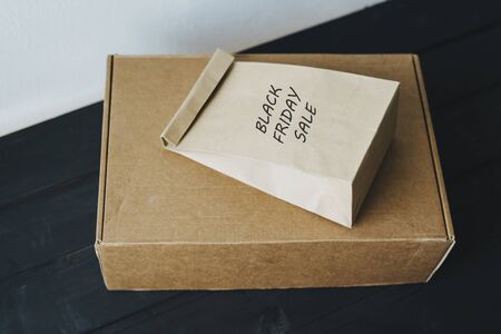 Shopping online at the black Friday sale. Box and package of recycled materials. Environmentally...