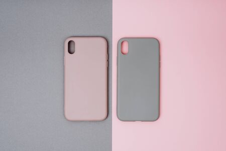 Two silicone protective cases for the smartphone. Grey and pink phone cases.の写真素材