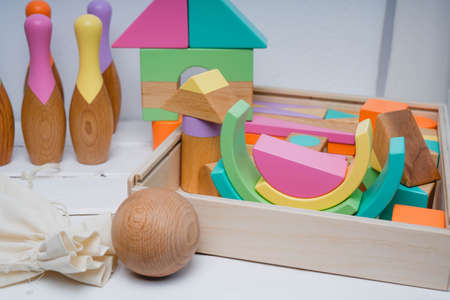 Childrens wooden toys in bright colors. Bright toys for children made of natural wood. Safe toys for...