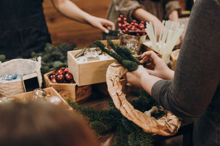 Wooden watermelon. Children's wooden toys. Toy rainbow made of natural wood for a small child. Hand holding a wooden rainbow in the form of a watermelon. Zero waste.の写真素材