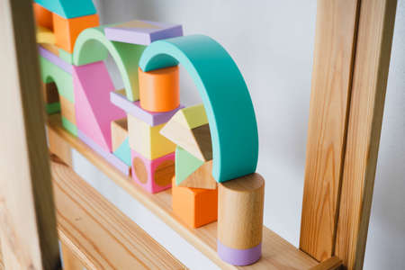 Childrens wooden toys. Wooden constructor for children. Colorful toys made of natural materials. Zero waste. Developing game.の写真素材