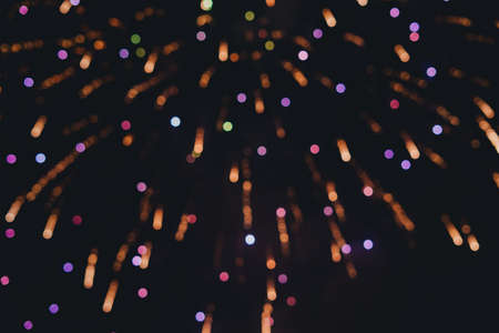 Abstract photo of fireworks. Salute without focus. Blurry photo of fireworks. Festive fireworks. A beautiful flicker of fireworks. Selective focus.の写真素材