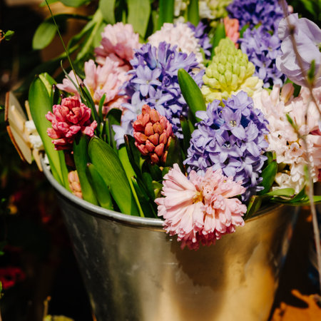 Flower shop. Sezhie flowers in iron buckets are sold on the market. Bouquet of hyacinthus and lathyrus odoratus.の写真素材