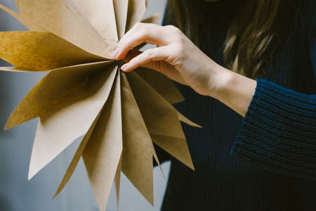 Creating hand made christmas ornaments. The origami stage.の写真素材