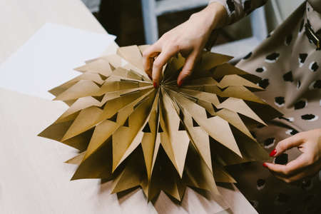 Creating hand made christmas ornaments. The origami stage.の写真素材