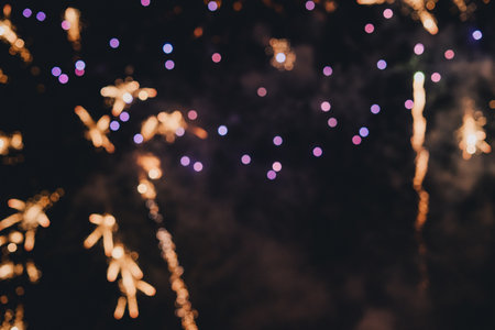 Abstract photo of fireworks. Salute without focus. Blurry photo of fireworks. Festive fireworks. A beautiful flicker of fireworks. Selective focus.の写真素材