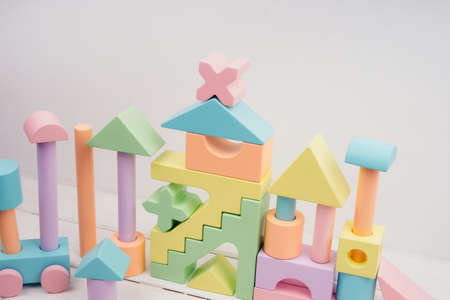 Children's toys made of natural material. Wooden colorful constructor for children. Colorful toys...