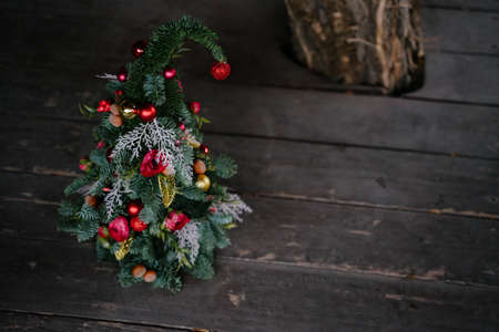 Floral Christmas tree handmade. Red toys and flowers.の写真素材