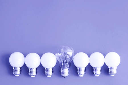Photo toned colored in trendy color of year 2022. Color 17-3938. Ecology light bulbs. Free space for...