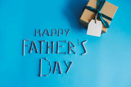 happy father's day. The inscription is assembled from screws and nails. Inscription from improvised...