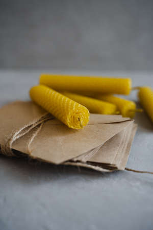 Candles made of natural honey wax. Craft envelopes for letters. vertical photo.の写真素材