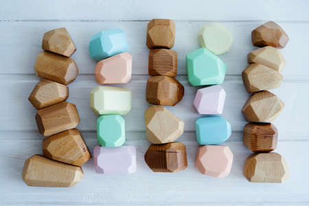 Toys made of natural wooden. No plastic toys. Colorful Montessori cubes.の写真素材