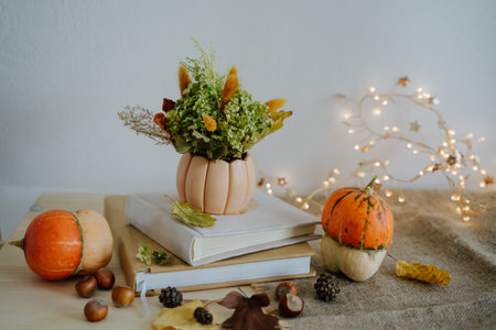 Autumn composition. Pumpkin. Thanksgiving Day. Garland with warm light. Bokeh.の写真素材