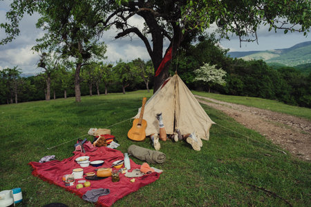 The family is lying in a tent. Family on vacation with a tent in the forest.の写真素材
