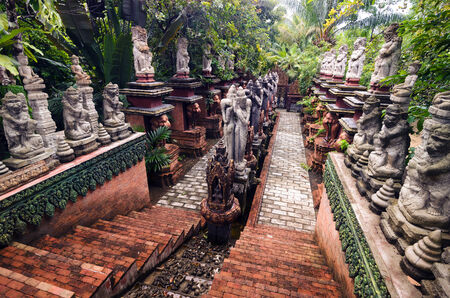 Stairs surrounded by statues of traditional Hindu Gods