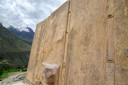 View to Inca Temple of the Sun wall and mountainsの写真素材