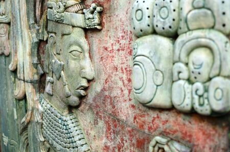 PALENQUE, MEXICO, DECEMBER 15, 2015: Mayan man image and Mayan writing symbols on an ancient wallのeditorial素材