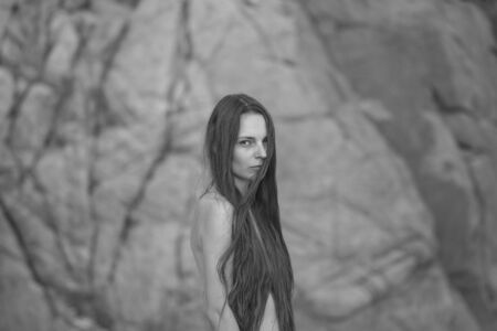 Portrait of beautiful young woman - topless outdoorsの写真素材