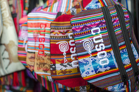 CUZCO, PERU, 08 FEBRUARY 2017: Colourful waist bags with sign Cusco at souvenir marketのeditorial素材