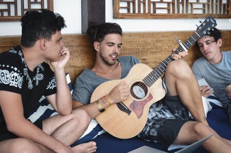 ARRAIAL DO CABO, BRAZIL, 5 SEPTEMBER 2016: 3 musicians writing songsのeditorial素材