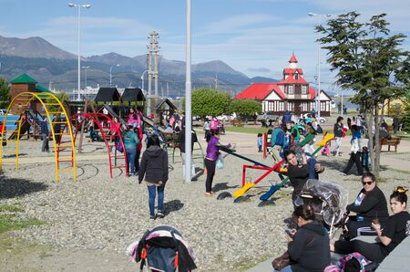 USHUAIA, ARGENTINA, 05 DECEMBER 2016: day off in Ushuaia, parents with little kids at the playgroundのeditorial素材