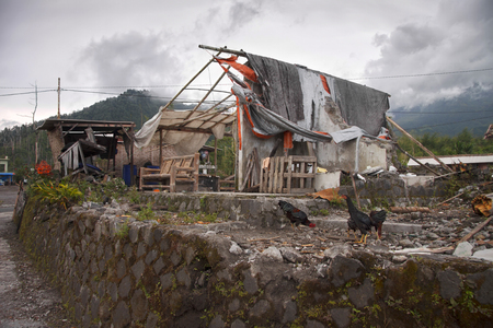 MERAPI, JAVA, INDONESIA, 22 MARCH 2012: improvised housing out of bamboo and trash in the area of volcano eruptionのeditorial素材